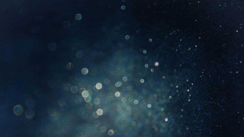glitter vintage lights background. gold, silver, blue and black.